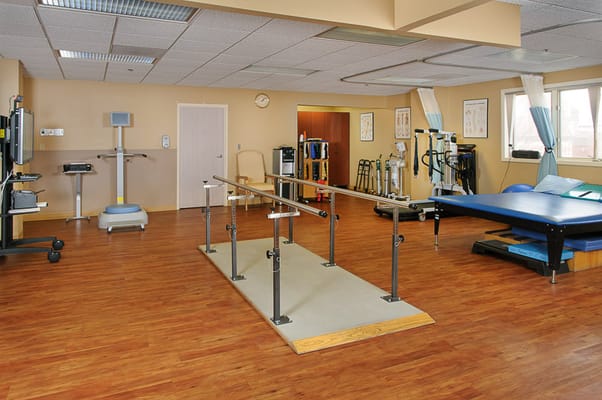Physical therapy room with exercise equipment
