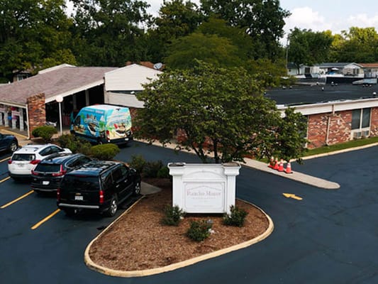 Exterior view of Rancho Rehab and Healthcare Center with parking area