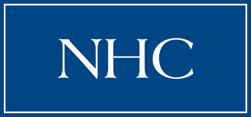 NHC facility logo in white on blue background