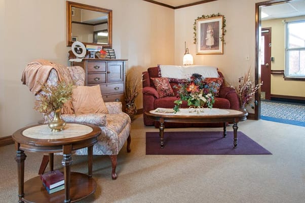 Cozy lounge area with floral decor and comfortable seating