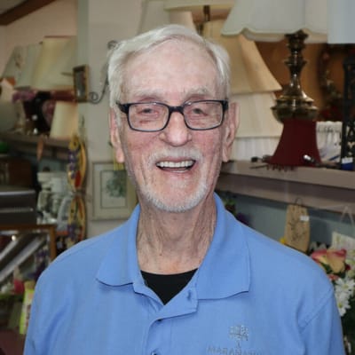 Smiling resident wearing a blue shirt