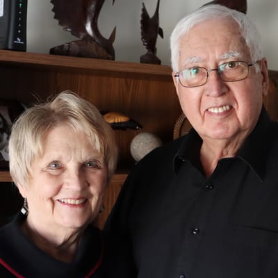 Two smiling residents posing for a photo