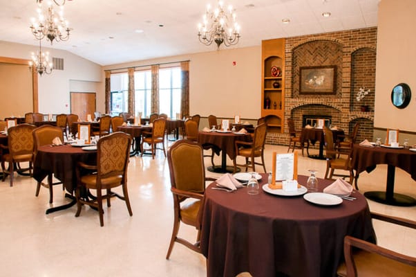 Elegant dining room with tables set for meals