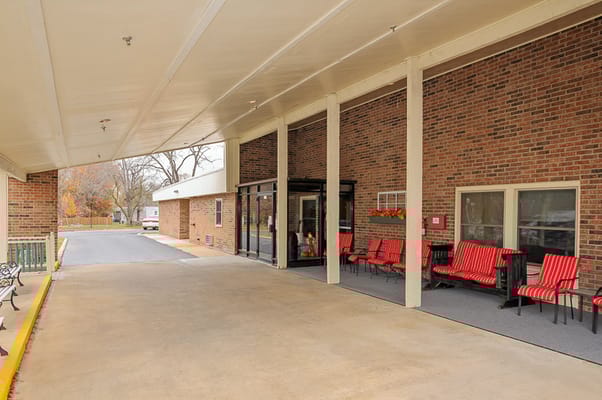 Covered entrance with seating and pathway