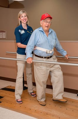 Staff assisting a resident in a therapy session