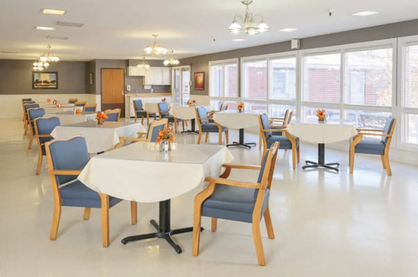 Bright dining area with tables and chairs