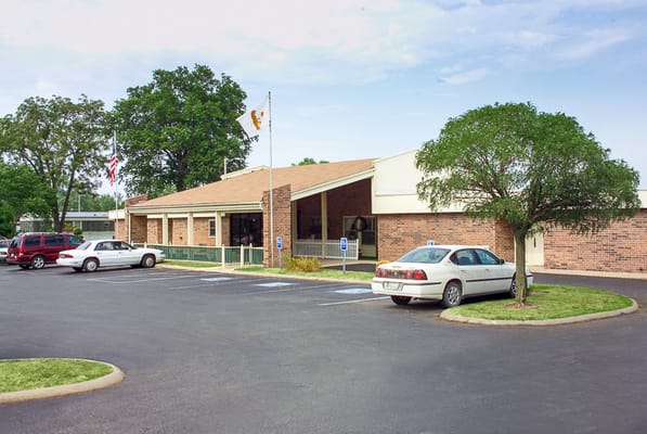 Exterior view of the facility with parking area