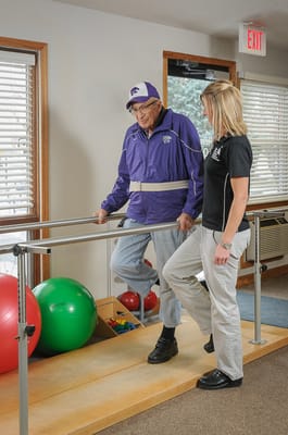 A resident receiving therapy with a staff member