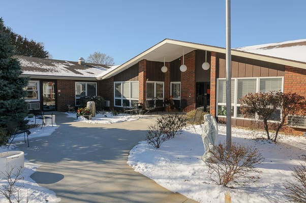 Exterior view of Life Care Center of Seneca with snowy pathway