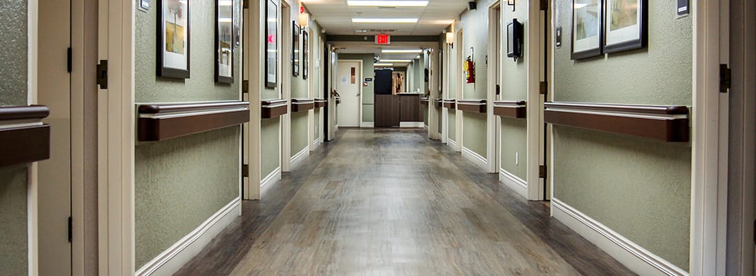 Well-lit corridor in a senior living facility