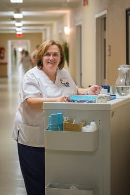 Staff member working in a hallway at the facility