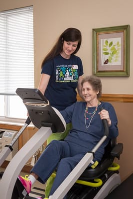 Resident engaging in occupational therapy with a staff member