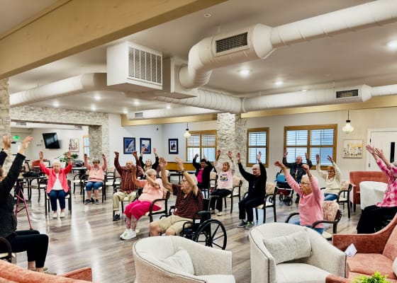 Residents participating in an exercise session in a common area