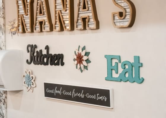 Decorative kitchen signs on a facility wall
