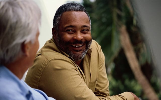 Two residents enjoying a conversation outdoors
