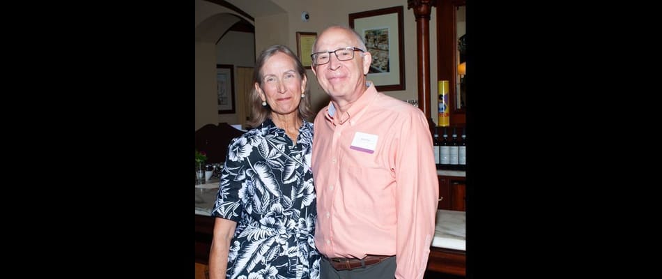 Two residents posing together in a lounge area