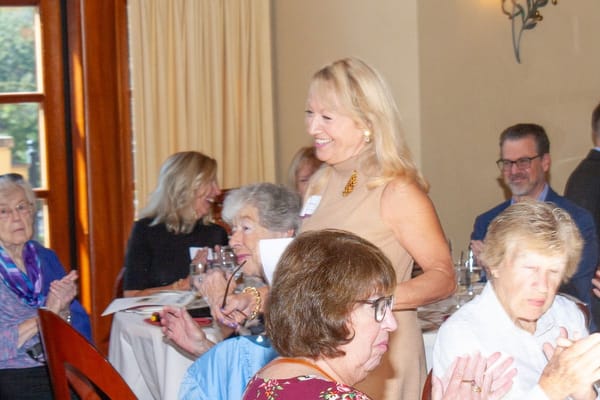 Residents and staff enjoying a gathering in a dining area