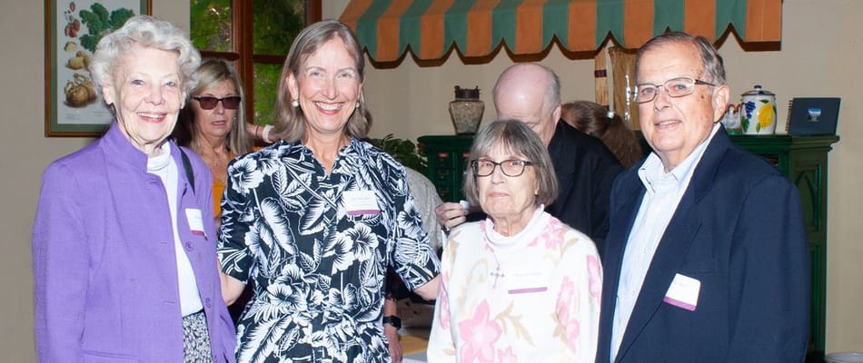 Residents and staff interacting warmly at an event