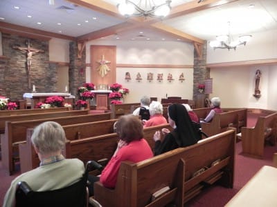 Residents attending a service in a chapel