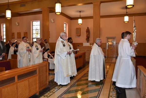 Residents and staff participating in a religious ceremony