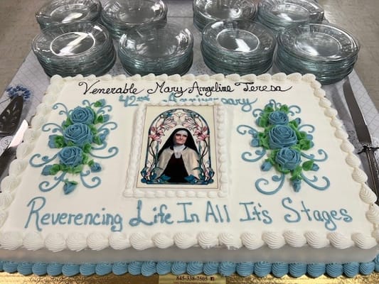 A decorated cake honoring Mary Angeline Teresa