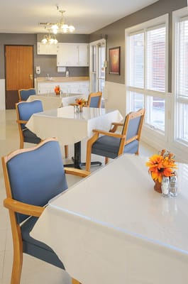 Bright dining area with tables and chairs