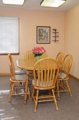 Bright dining area with a wooden table and chairs