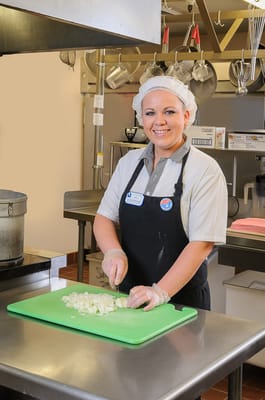 Staff member preparing food in the kitchen