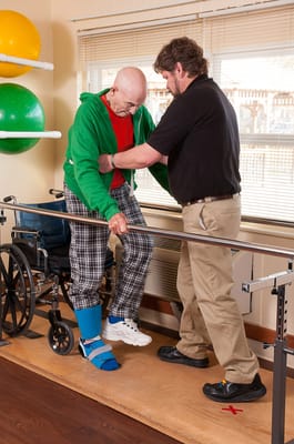 Therapist assisting resident with walking
