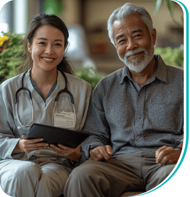 A caregiver and senior resident smiling together