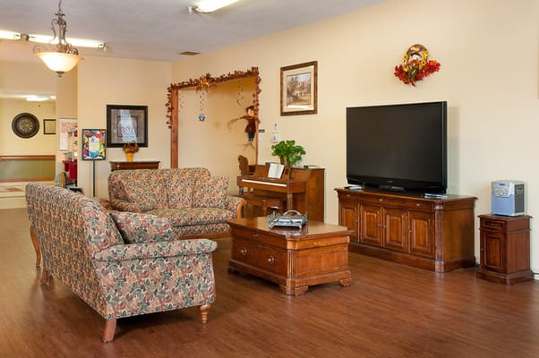 Common area with seating and entertainment unit
