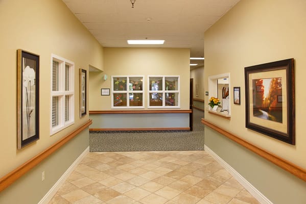 Hallway interior with artwork and seating