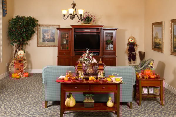 Decorated living room with autumn-themed decor