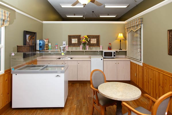 Bright common area with a kitchenette and seating