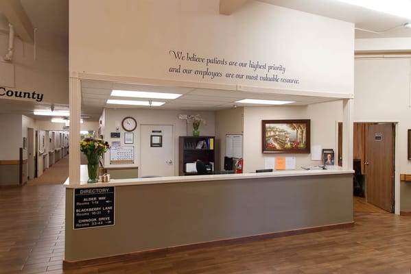 Reception area with a welcoming message and directory