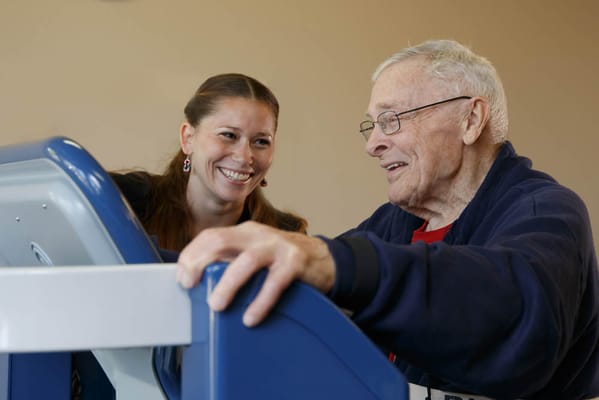 Staff assisting a resident with an activity