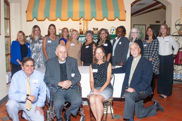 Group of staff and residents in a social setting