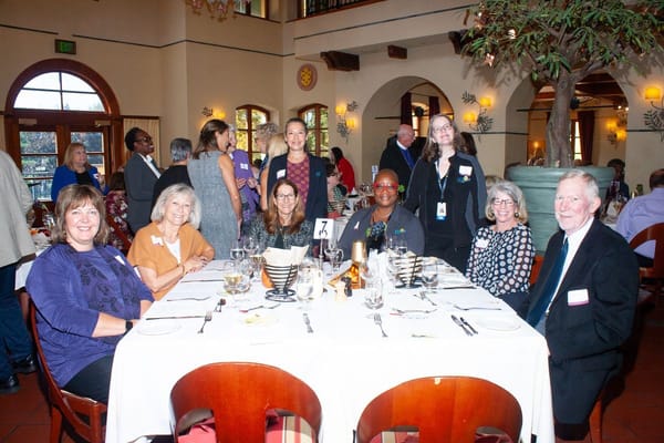 Group of people enjoying a meal in the dining room