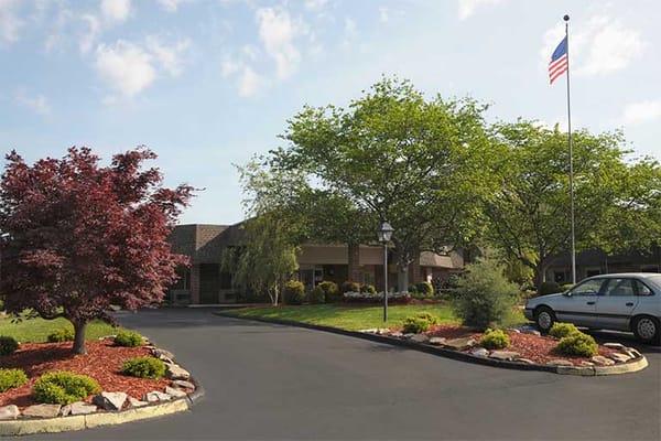 Exterior view of the facility with landscaped entrance