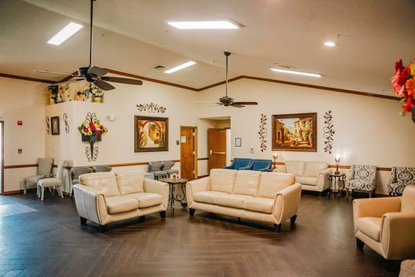 Common area with seating and artwork on the walls