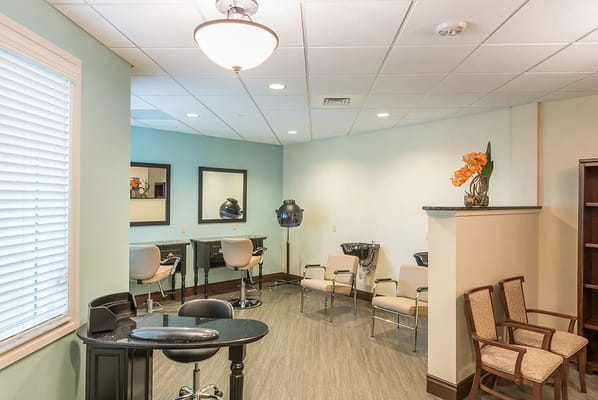 Interior of a hair salon space with chairs and styling tools