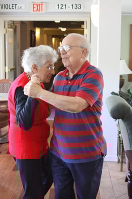 Couple dancing together in a common area