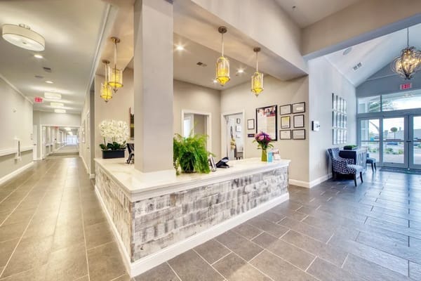 Bright lobby area with front desk and seating