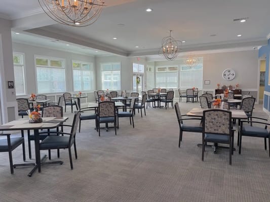 Bright dining room setup with tables and chairs