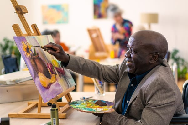Resident painting in an art activity session