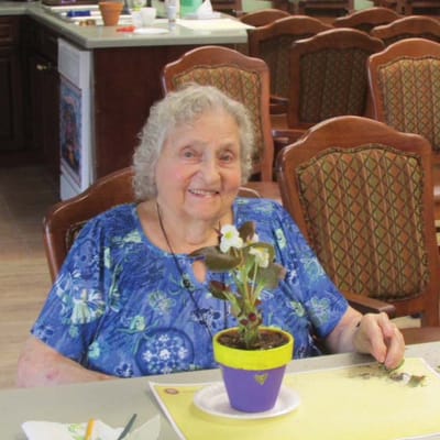 Resident participating in a gardening activity indoors