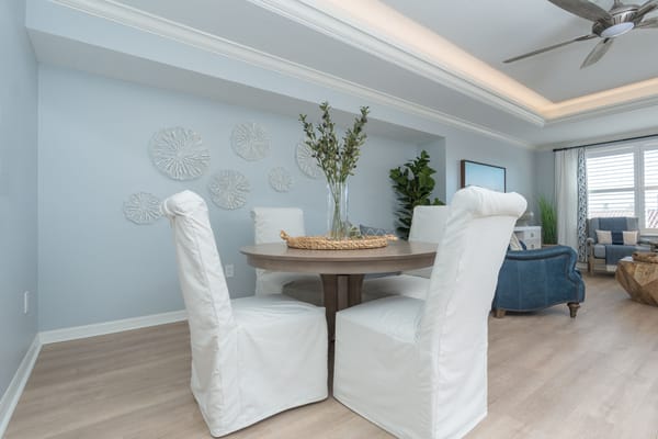 Bright interior common area with a dining table