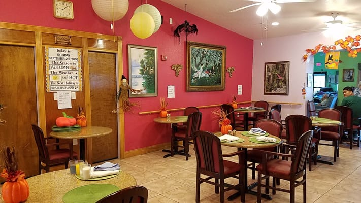 Dining area with seasonal decorations and seating