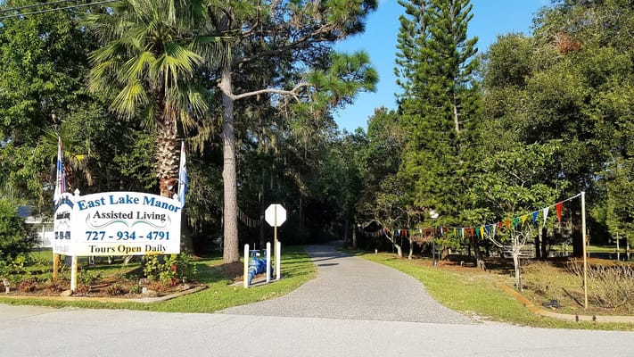 Entrance to East Lake Manor surrounded by trees