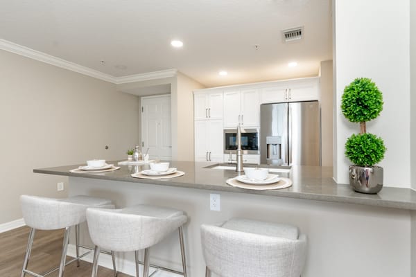 Modern kitchen and dining area in a resident unit